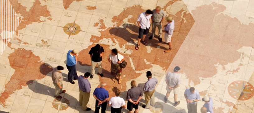 people standing on large globe